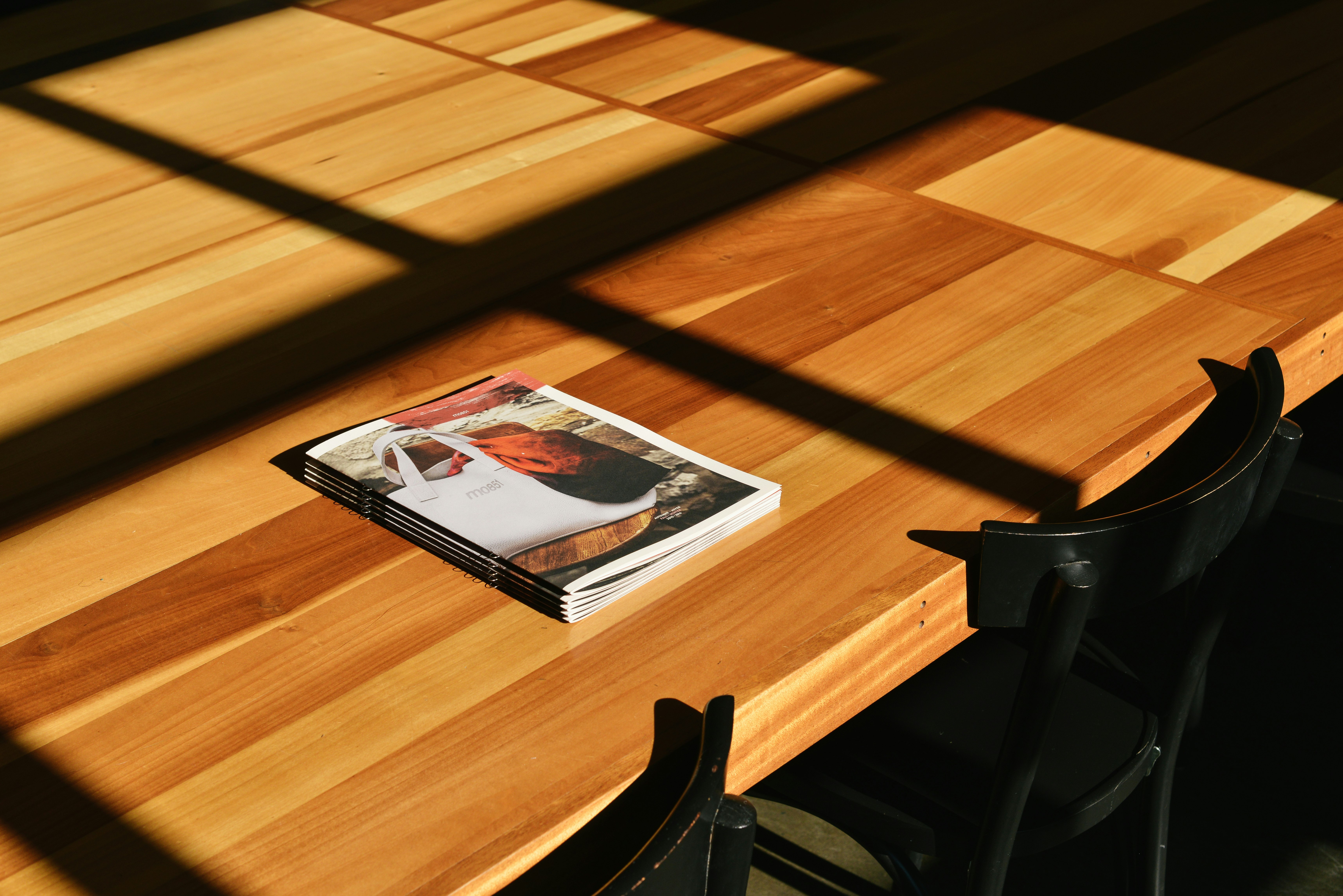 white labeled book on brown table